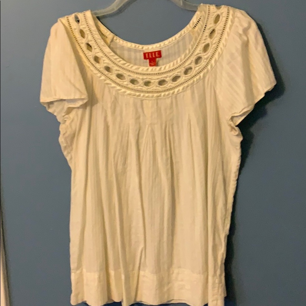 Beautiful off-white top with satin trim at neck